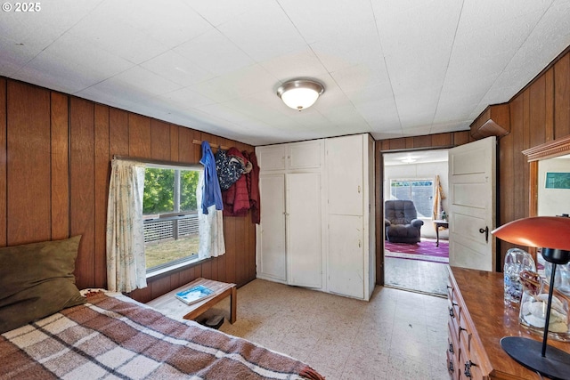 1387 Washington Ave, Coos Bay, OR 97420 - bedroom with wood walls, a closet, and light flooring