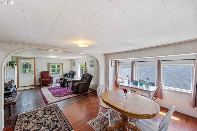 1387 Washington Ave, Coos Bay, OR 97420 - dining space with arched walkways and wood-type flooring