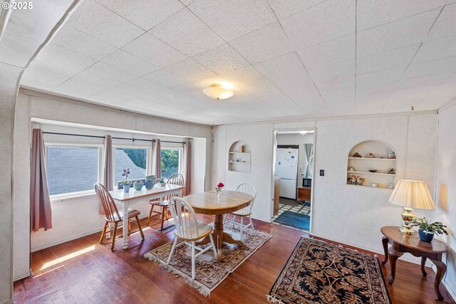 1387 Washington Ave, Coos Bay, OR 97420 - dining room with built in shelves and wood finished floors