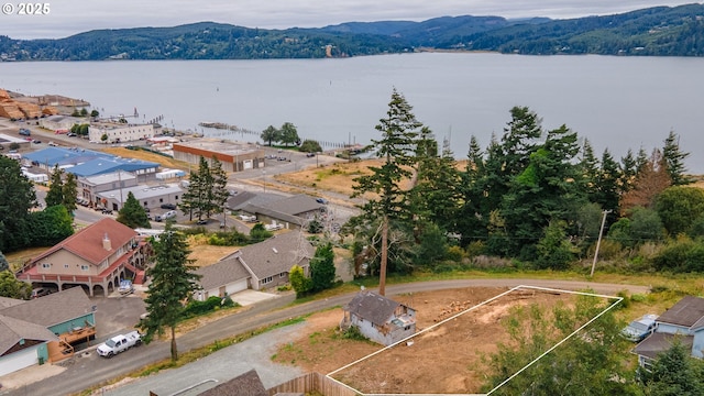 609 Vermont St, North Bend, OR 97459 - aerial view of property's location with property boundaries highlighted and a water and mountain view