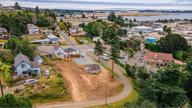 609 Vermont St, North Bend, OR 97459 - aerial overview of property's location with a large body of water and nearby suburban area