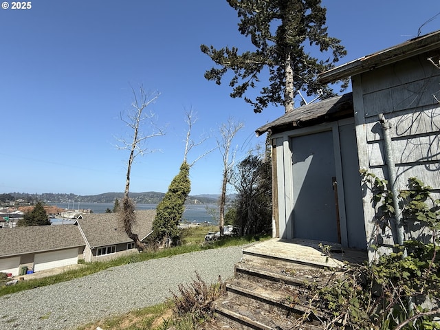 609 Vermont St, North Bend, OR 97459 - view of yard with a water view and an outbuilding