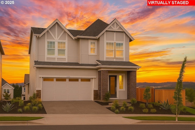17960 SW Alvord Ln, Beaverton, OR 97007 - view of front of house with a garage, driveway, and stucco siding
