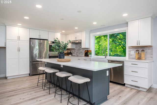 10014 NE 146th Ave, Vancouver, WA 98682 - kitchen with appliances with stainless steel finishes, light wood-style flooring, white cabinetry, and recessed lighting