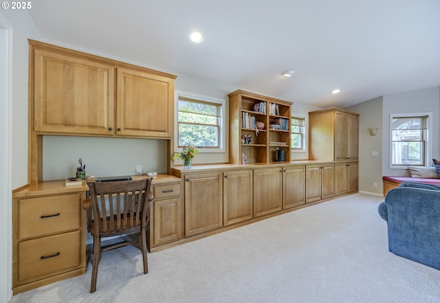 home office with built in study area, light colored carpet, recessed lighting, and baseboards