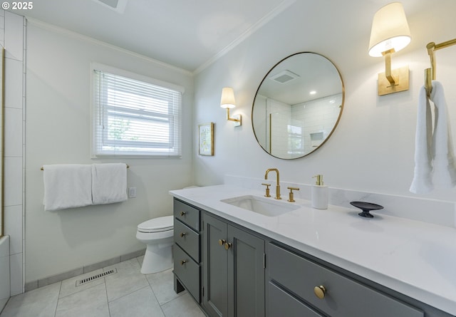 bathroom featuring crown molding, a shower, toilet, vanity, and baseboards