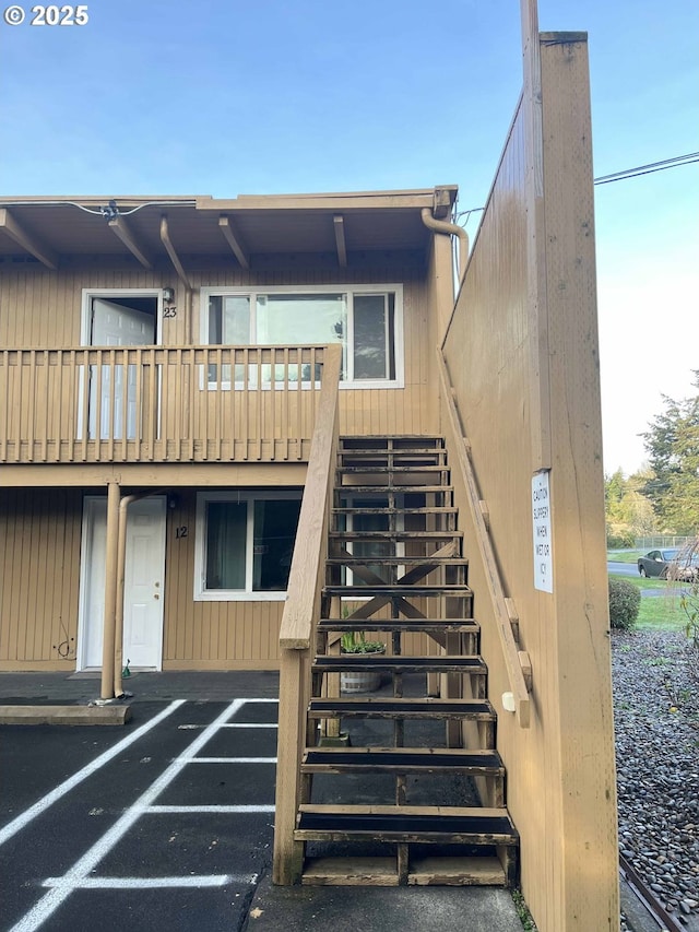 back of property with a balcony