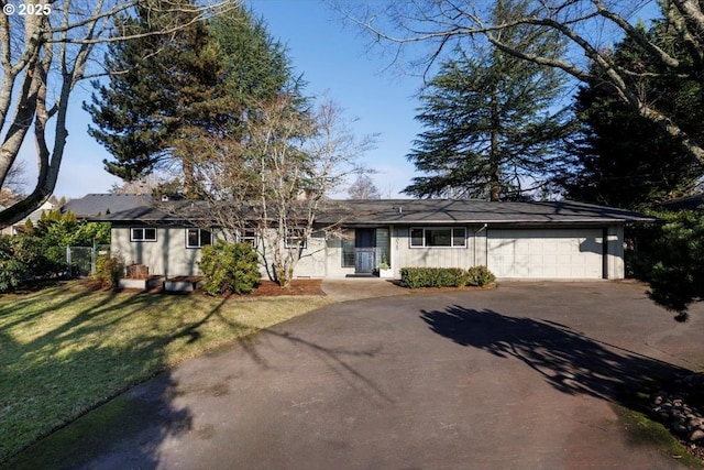 ranch-style house with a front lawn and a garage