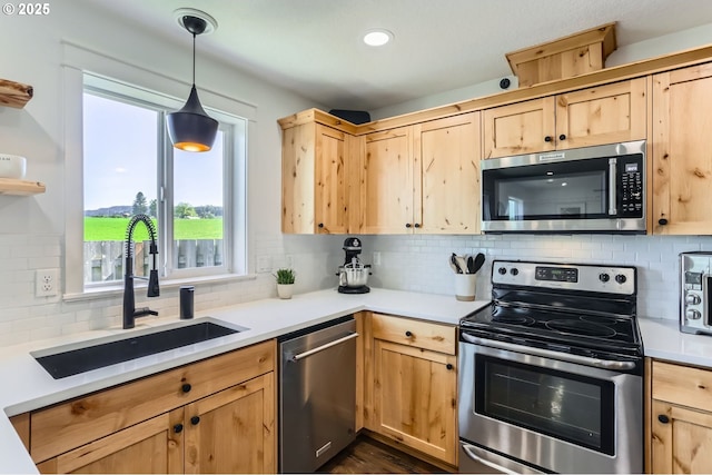 1028 E 16th St, Lafayette, OR 97127 - kitchen featuring stainless steel appliances, light brown cabinetry, a sink, and tasteful backsplash