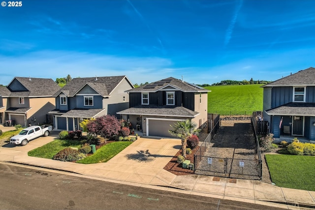 1028 E 16th St, Lafayette, OR 97127 - view of front of property featuring driveway, solar panels, a residential view, a gate, and a garage