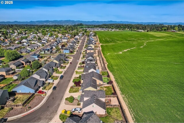 1028 E 16th St, Lafayette, OR 97127 - aerial perspective of suburban area featuring a mountainous background