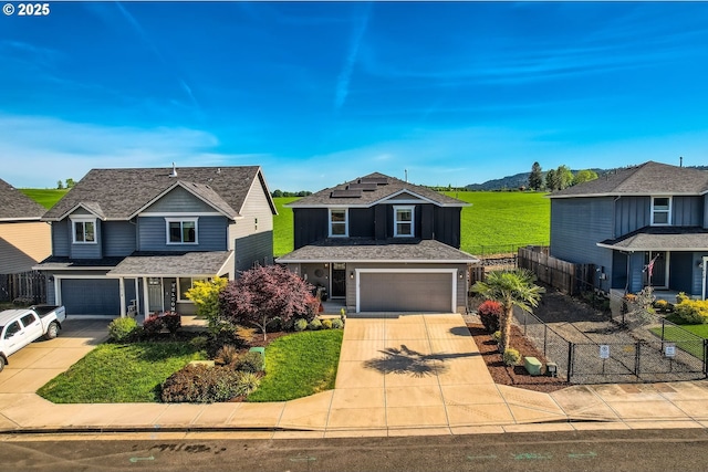 1028 E 16th St, Lafayette, OR 97127 - traditional home featuring concrete driveway, fence, and a garage