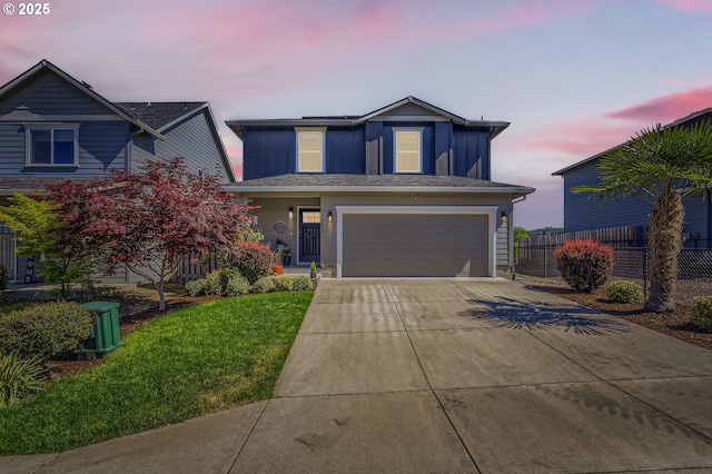 1028 E 16th St, Lafayette, OR 97127 - traditional-style house with an attached garage, driveway, and board and batten siding