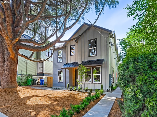 1616 SE Morrison St, Portland, OR 97214 - modern farmhouse with board and batten siding, a standing seam roof, and metal roof