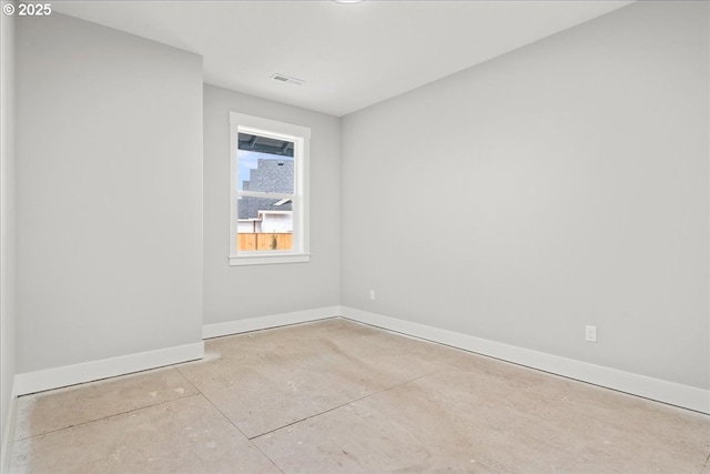 empty room with baseboards and visible vents