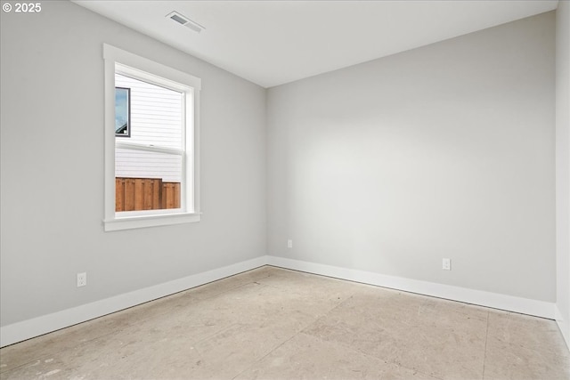 spare room with visible vents and baseboards