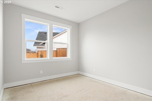 empty room with visible vents and baseboards