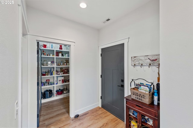 2130 Fir St, North Bend, OR 97459 - entrance foyer with light wood finished floors, baseboards, and recessed lighting