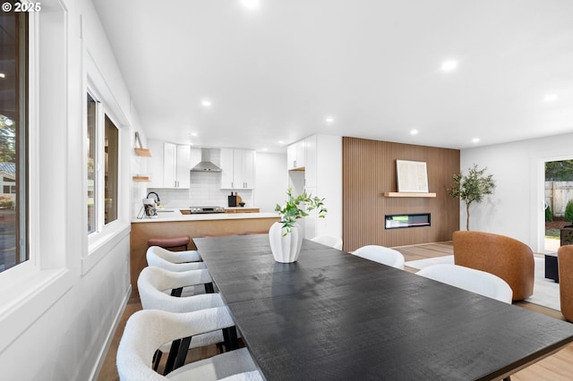 dining room featuring light hardwood / wood-style flooring and sink