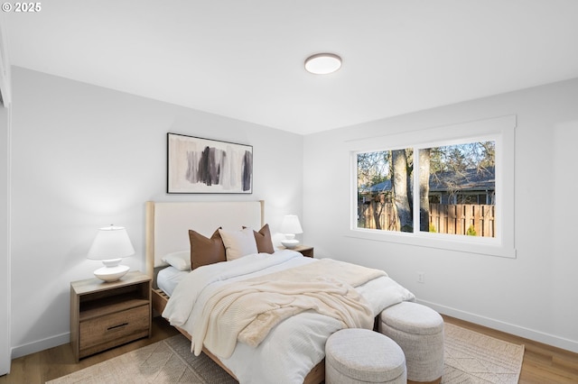 bedroom with hardwood / wood-style floors