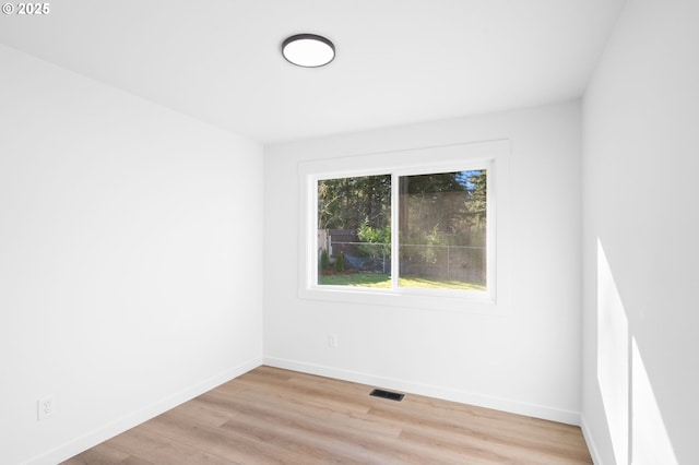 empty room with light hardwood / wood-style floors