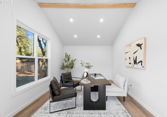 home office with vaulted ceiling with beams and light wood-type flooring