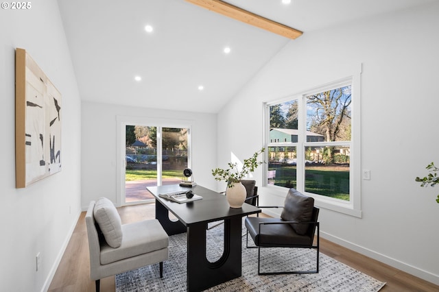 dining space with vaulted ceiling with beams and hardwood / wood-style flooring