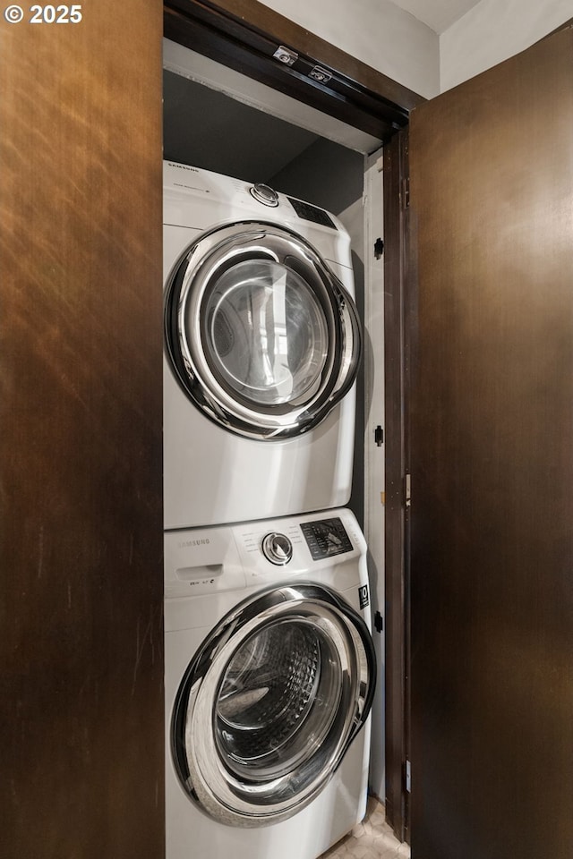 laundry area with laundry area and stacked washing maching and dryer