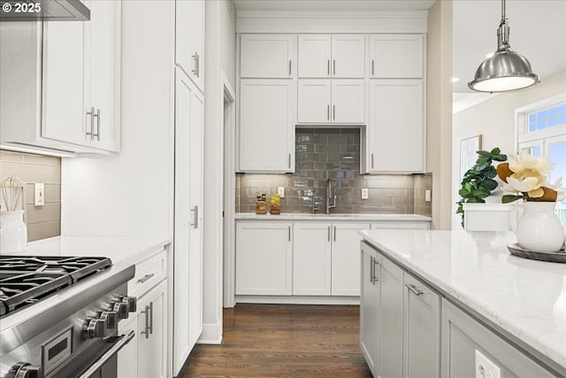 9037 NW Murdock St, Portland, OR 97229 - kitchen with white cabinetry, backsplash, dark wood finished floors, and pendant lighting