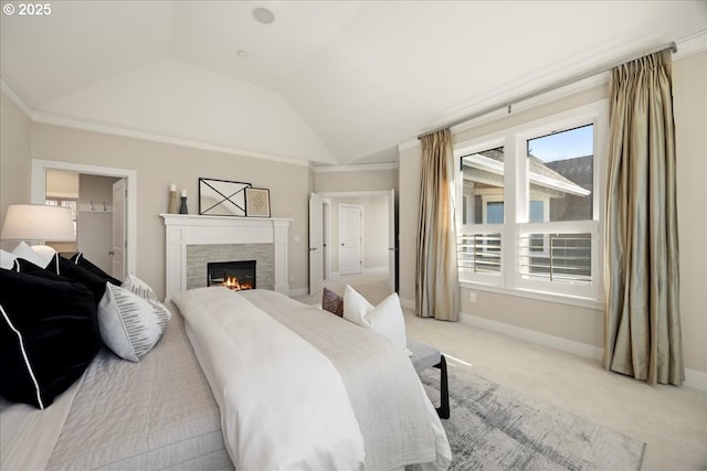 9037 NW Murdock St, Portland, OR 97229 - bedroom with vaulted ceiling, multiple windows, light carpet, a tiled fireplace, and baseboards