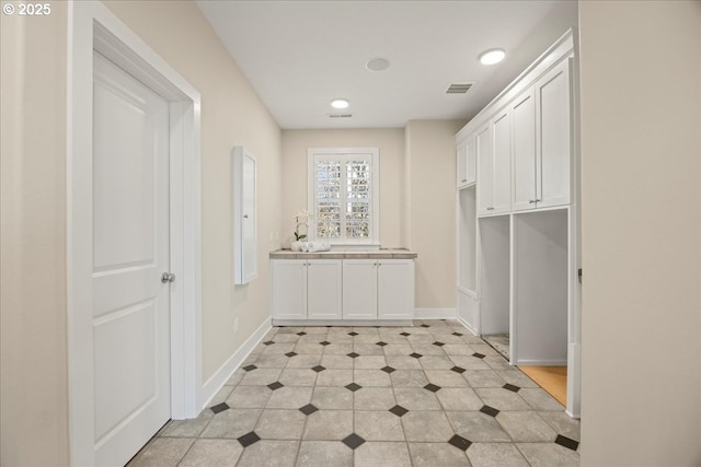 9037 NW Murdock St, Portland, OR 97229 - laundry area featuring baseboards and recessed lighting