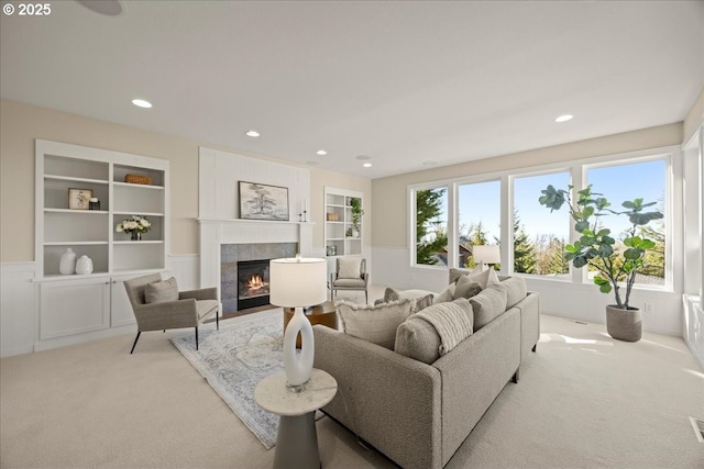 9037 NW Murdock St, Portland, OR 97229 - living room with carpet, a fireplace, built in features, and recessed lighting