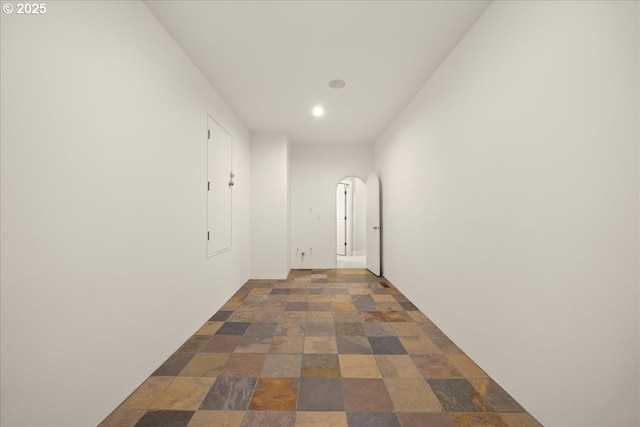 9037 NW Murdock St, Portland, OR 97229 - hallway featuring recessed lighting, arched walkways, and dark stone finish floors