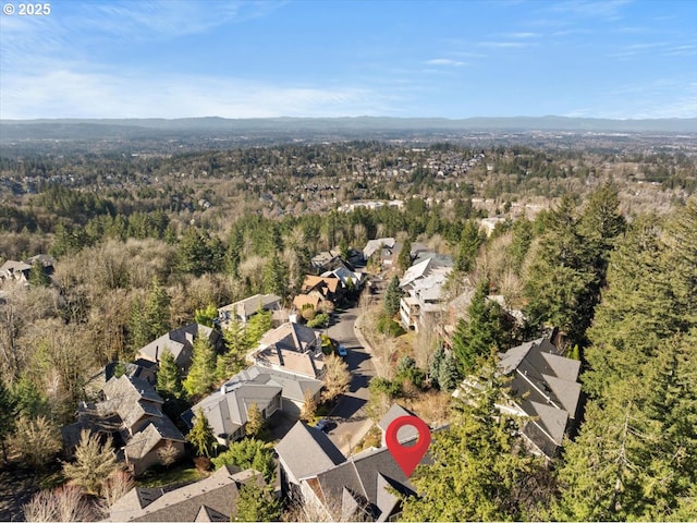9037 NW Murdock St, Portland, OR 97229 - aerial view of property and surrounding area with a heavily wooded area and nearby suburban area