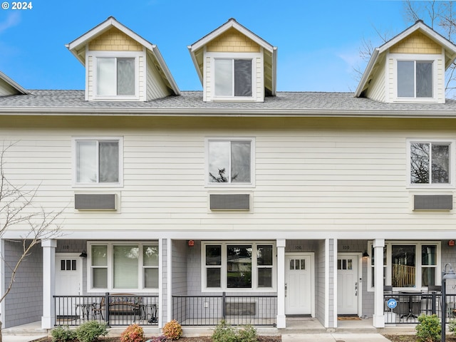 view of property with covered porch