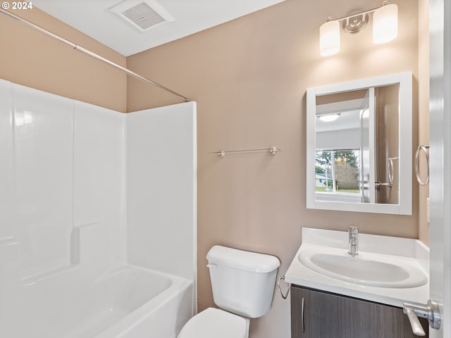 full bathroom with vanity, toilet, and shower / washtub combination