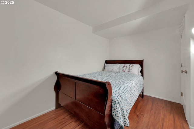 bedroom with wood-type flooring