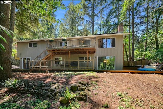 rear view of property with a deck