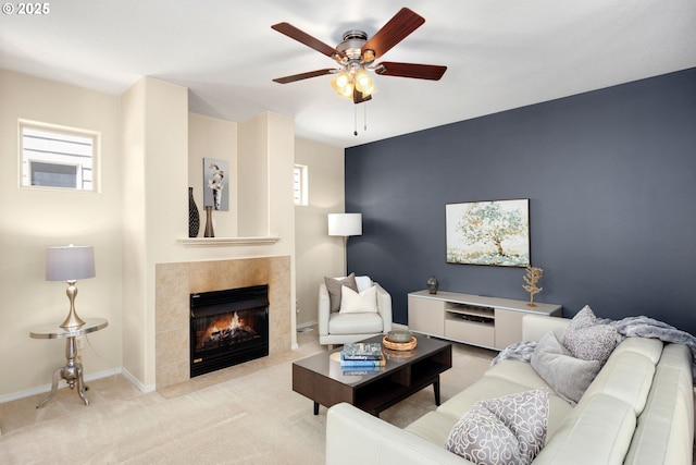 18646 SW Hideo Ct, Beaverton, OR 97003 - carpeted living area with a tile fireplace, ceiling fan, and baseboards