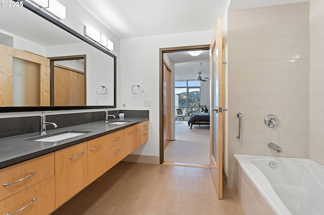 bathroom featuring tile patterned flooring, vanity, separate shower and tub, and ceiling fan