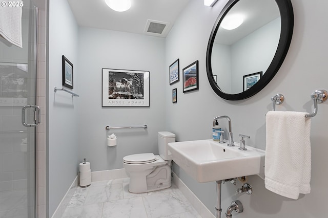 bathroom featuring sink, toilet, and walk in shower