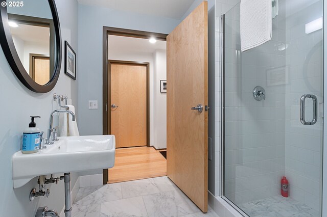 bathroom featuring an enclosed shower