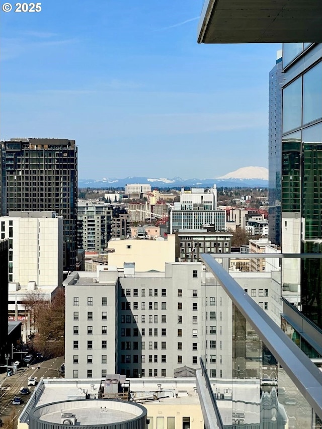 property's view of city with a mountain view