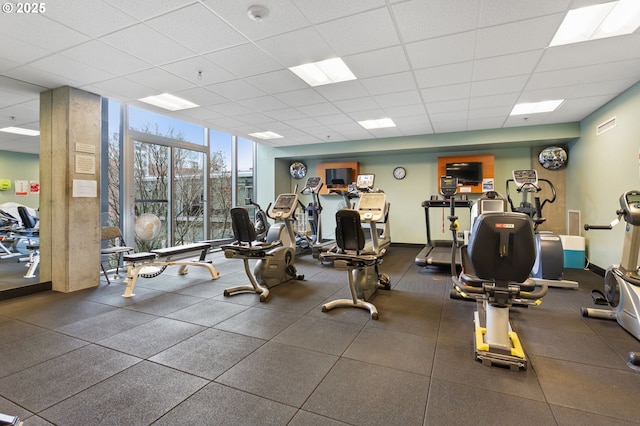 exercise room featuring a drop ceiling