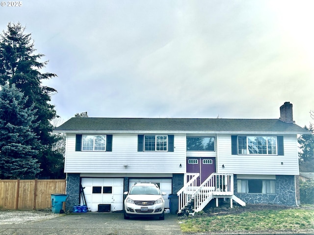 bi-level home featuring a garage