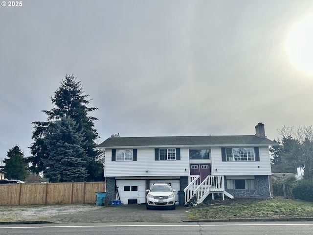 raised ranch featuring a garage