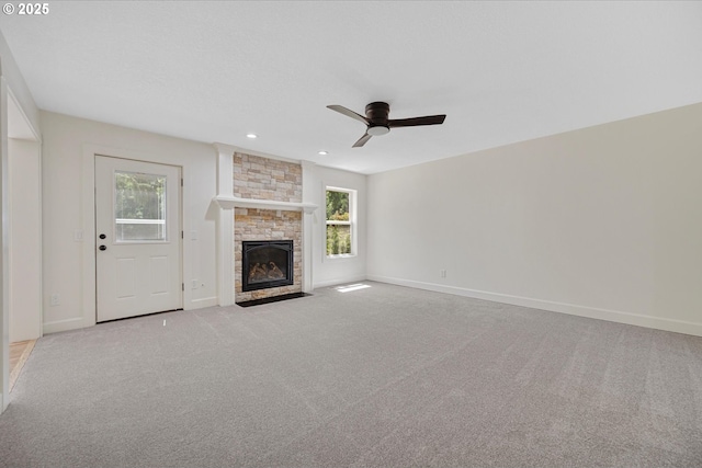 9240 SW Stono Dr, Tualatin, OR 97062 - unfurnished living room featuring plenty of natural light, a fireplace, carpet flooring, a ceiling fan, and recessed lighting