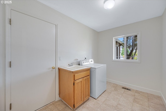 9240 SW Stono Dr, Tualatin, OR 97062 - laundry area featuring washer / dryer and cabinet space