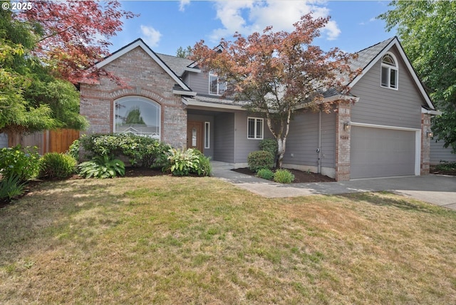 9240 SW Stono Dr, Tualatin, OR 97062 - traditional home featuring driveway, a garage, and brick siding