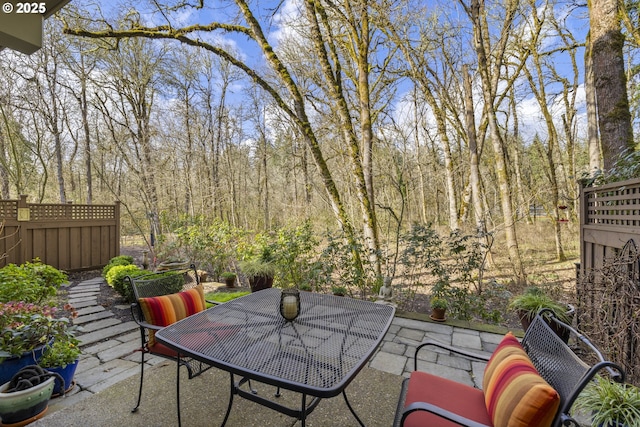 view of patio with a wooded view